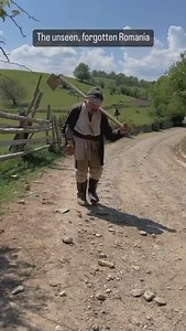 What does it mean to be abandoned? Zaharia, 82, sits at the frayed edges of a forgotten world, where Romania’s villages are unraveling like old embroidery left to the moths. He is not a relic—no, that would suggest admiration, preservation. He is an echo, a man whose voice was once part of a great chorus, now reduced to a whisper against the hollow wind. His hands, gnarled and furrowed like the land he spent a lifetime tilling, once built, once fed, once gave. Now they grasp at nothing but memor