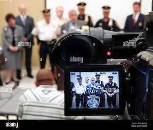 Chief Assistant Passaic County Prosecutor James Wilson, is seen in a video monitor as he stands with police officers from Wayne, N.J. and the Passaic County Sheriff's office, as he announces Wednesday June 27, 2007, in Totowa , N.J., that five recently graduated high school students have been arrested in connection with pyrotechnic devices found at Wayne Valley High School in mid-June that led to the school's evacuation one day before the start of final exams. (AP Photo/Mel Evans Stock Photo - A