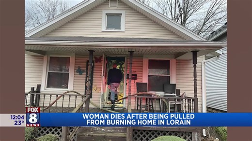 Woman dies after being pulled from burning home