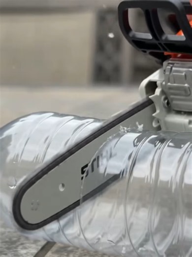 Mini chainsaw cuts through plastic bottle. #seasaws #seamoresaws #minichainsaw #saws #cut #chainsaw