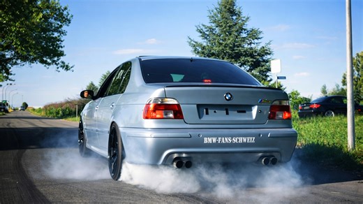 BMW M5 engine roars with burnout and tire smoke
