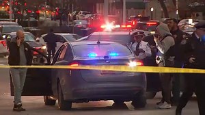 Officer struck by wrong-way driver while guarding getaway car in unrelated robbery in Manhattan