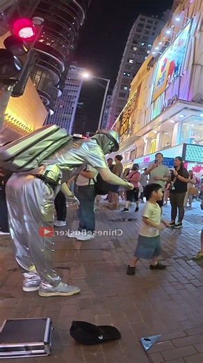 Do Kids Dare Touch the Robot Street Performer in China?