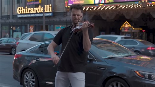 Classical violinist covers iconic Thunderstruck song in public