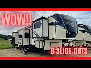 Crazy brand new 5th wheel camper with 6 slide-outs! This RV ROCKS! Camper Tour