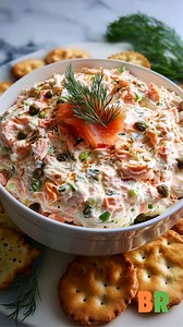 Smoked Salmon Dip 🐟🧄 A refined, velvety seafood spread where smoky salmon, bright citrus, and aromatic herbs fold together into a balanced, creamy appetizer. This preparation teaches gentle mixing for optimal texture and clean, well-defined flavor. Ingredients: 8 ounces cream cheese, softened 1/2 cup sour cream 2 teaspoons lemon juice 1 teaspoon lemon zest 1 tablespoon capers, drained 2 tablespoons fresh dill, chopped 1/4 cup green onions, finely sliced 4 ounces smoked salmon, shredded or chop