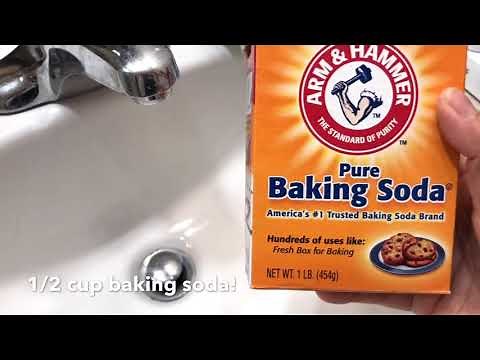 Cleaning your sink drain with baking soda and vinegar