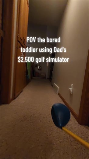 Toddler Enjoys Dad's Golf Simulator