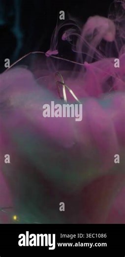 Vertical video. Underwater blur smoke. Glowing light bulb. Illuminated garland glass abstract color splash. Pink blue cloud ink flow on black background Stock Video Footage - Alamy