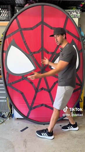I made a giant DIY Spider-Man backdrop for my son’s birthday party for under $35. It’s over 7 feet tall and made from PEX pipe, table covers, and pool noodles. The perfect budget-friendly party decor for a superhero birthday. What else should I add to this backdrop? #diy #birthdayparty #spiderman