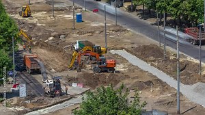 Industrial truck loader excavator moving earth and loading into a dumper truck timelapse