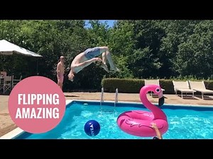 Man's amazing dive through inflatable flamingo