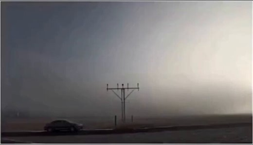 The world's biggest plane, the Antonov An-225 Mriya clears the fog while landing