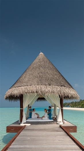 Anantara Dhigu Maldives Resort on Instagram: "Experience the art of traditional Thai massage in our unique open-air Thai sala. At the heart of the Anantara Spa experience, guests are invited to enjoy Thai stretching in a tranquil, open-air sanctuary. Guided by skilled therapists, this ancient healing practice blends rhythmic pressure point techniques with assisted, yoga-like stretches that gently move the body, releasing muscular tension, enhancing flexibility and restoring natural energy flow,