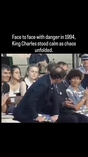 The Grave of Time on Instagram: "In 1994, King Charles III-then Prince of Wales-faced an assassination attempt during a public event in Sydney, Australia. As he was giving a speech at a ceremony celebrating Australia Day, a man named David Kang suddenly rushed the stage and fired two blank shots from a starter pistol before being swiftly tackled by security. Charles remained remarkably calm throughout the ordeal, barely flinching and continuing to stand at the podium with a composed expression,
