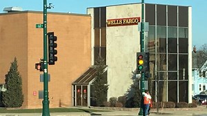 Former bank manager charged with assaulting teller