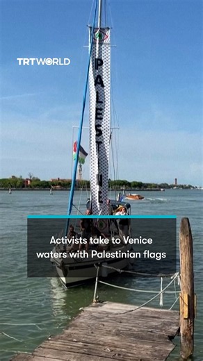Activists sail with Palestinian flags during Venice film festival