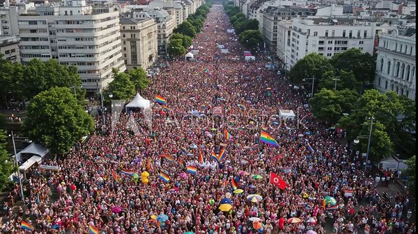 Massive LGBTQ+ Pride Parade Celebration Through Urban Streets with Flags and Banners