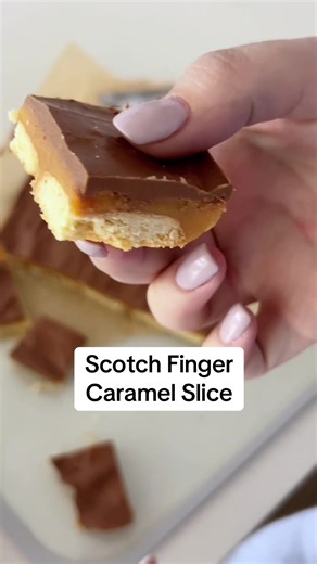 Ingredients: • 1 packet of Scotch Finger biscuits • 395g sweetened condensed milk • 60g butter • 2 tbsp of golden syrup • 180g milk or dark chocolate • 1 tsp vegetable oil Method: 1. Preheat oven to 170°C fan-forced. Grease and line an 18cm x 28cm slice tin, extending paper 2cm above edge of tin. 2 Biscuit Base: Place Scotch Finger biscuits (face down) in the tray. 3 Caramel Filling: Place condensed milk, golden syrup and butter in a saucepan over medium heat. Cook, stirring, for 8 minutes or un