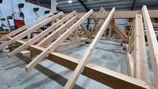 A timber frame is more than structure — it’s art, engineering, and tradition combined. #TimberFrame #Handcrafted #MortiseAndTenon #WoodJoinery #TimberCraft | Frame Work Plus, Inc
