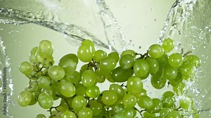 Super slow motion of grapes with water splash flying in the air. Filmed on high speed cinema camera, 1000 fps.