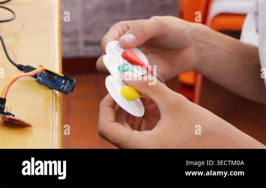 An unrecognizable child is evaluating homemade electrodes to assess performance in a health technology project in a classroom in Neiva, Huila, Colombia. Concept of science and technology Stock Video Footage - Alamy