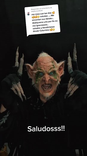 Creature Costume Transformation in Dark Setting