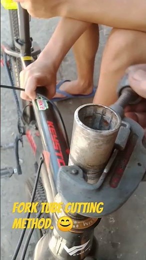 Cutting off threadless fork tube by using a pipe cutter.