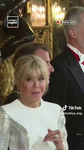 French President Emmanuel Macron and his wife Brigitte arrive with King Felipe VI of Spain and Queen Letizia for a gala dinner at the Royal Palace in Madrid.