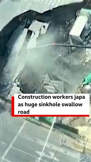 One large sinkhole appear for Shanghai Minhang District for China during metro construction. Di footage show workers dey run to safety as di sinkhole swallow large section of di road and cause damage to nearby structures. Dem no report say anybodi kpai or injure. | BBC News Pidgin