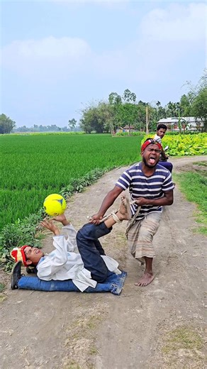 Playing football in the middle of the road..