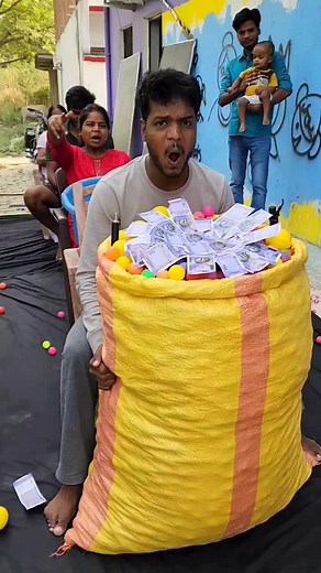 Outdoor Fun with Colorful Balls and Currency Notes