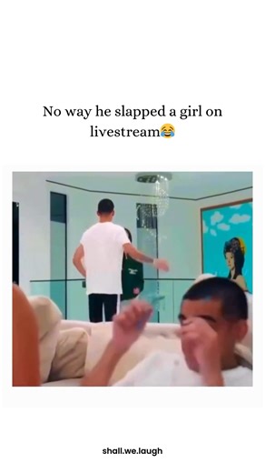 Shall we laugh? on Instagram: "This video features a 7-second clip from a live stream that captures a shocking physical altercation, captioned “No way he slapped a girl on livestream😂” to mirror the disbelief of the online audience. The footage shows a man and woman arguing in the background while another man sits in the foreground, seemingly ignoring the tension until a loud, sudden slap echoes through the room. The audio captures the immediate fallout, with the woman letting out a cry of pain