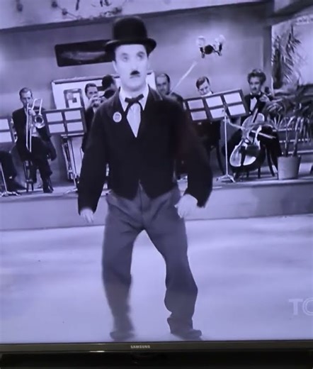 dancing backwards/He can't find the words to the song.