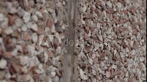 Pebble dash surface mixture of concrete and pebbles applied on building