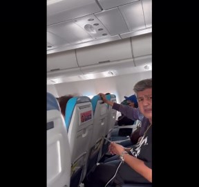 Trembling passenger pray for a safe landing as severe turbulence hits flight