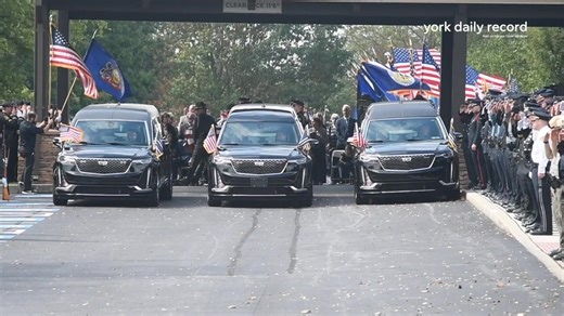 The memorial service for three officers killed in the line of duty in York County included a flyover and gun salute with bagpipes. | York Daily Record/Sunday News