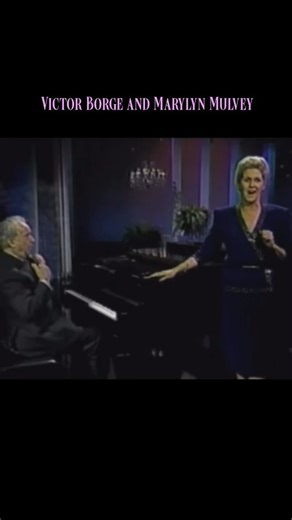 @record.collector on Instagram: "🎹✨ In this unforgettable comedy duet, the legendary Victor Borge teams up with soprano Marylyn Mulvey for a hilariously chaotic rendition of Verdi’s “Caro nome” from Rigoletto. As Mulvey delivers the aria with poise and stunning vocal control, Borge turns the piano into a comedy stage — interrupting her with playful gestures, mock instructions (“don’t touch my piano!”), and even tumbling off his bench (not in this clip). The brilliance lies in the contrast: her 