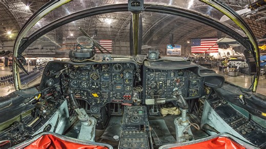 On March 10, 1966, Major Bernard F. Fisher took off in an A-1E Skyraider from Pleiku, South Vietnam, to fly a routine bombing and strafing mission. Soon after taking off, he was diverted to Ashau, where a Special Forces camp was under heavy attack by 2,000 North Vietnamese troops. Arriving over the area. Major Fisher found four Skyraiders. which had also been diverted, circling over a dense cloud cover. He led his wing man and two of the other A-1Es down through a hole in the overcast. As they f