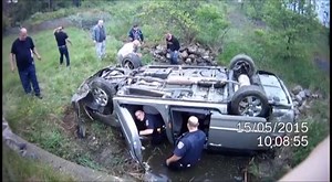 Police body camera captures the moments after a van flipped into a ravine, landing in several feet of water. Click to see more. http://shout.lt/3Ppd | Cleveland 19 News