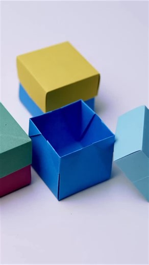 The Crafty Tube on Instagram: "DIY Origami Box 📦 | Easy Paper Craft Tutorial! Learn how to make a beautiful square-shaped origami box with just one sheet of paper! 🎨✨ Perfect for storing small items, gifts, or just for fun. Try it now and tag me in your creations! #Origami #PaperCraft #OrigamiBox #PaperFolding #DIYCrafts #HandmadeGift #PaperArt #EasyOrigami #CraftIdeas #CreativeHobby #GiftBox #OrigamiTutorial"