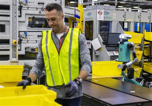 As Amazon's robot ranks swell, workers worry about their future
