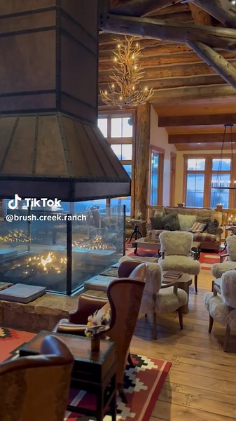 There’s no cozier place than by the lodge fireplaces with veiws of rolling meadows and grazing horses. #LuxuryTravel #LuxuryRanch #AmericanWest