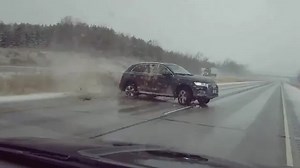 Out of control 4x4 nearly totals police car on icy road