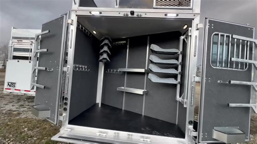 Custom ✨TWO BEDROOM✨ Bunk Bed Laramie Heading to NFR!! 🎲 This one has 18’ living quarters, sofa in slide-out, bunk beds in second bedroom, bar (with hanging barstools), and a TON of 🔥 options, including integrated hay pod, generator, backup camera with wi-fi, extra large full-sized rear tack area (with added swing-out saddle rack and adjustable shelving), extra step under awning, central vac system, extra tray ceiling (in gooseneck), and so much more. We’ll have this trailer (and others) upsta