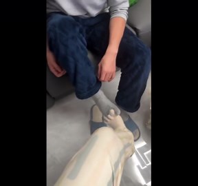 Couple laughs as toe socks interlock like holding hands in Heilongjiang, China