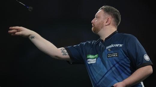Darts player sorry for repeatedly punching table after tough loss at world championship