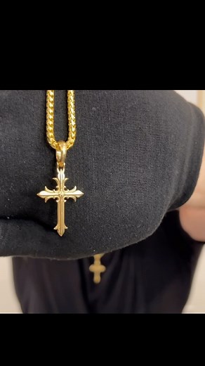 This gold cross pendant, named Faith, is a powerful religious and...