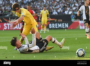 Bremen, Germany. 12th June, 2023. Soccer: Internationals, Germany - Ukraine, wohninvest Weserstadion. Germany's Kai Havertz (r) and Ukraine's Eduard Sobol (l) in a duel. IMPORTANT NOTICE: In accordance with the regulations of the DFL Deutsche Fußball Liga and the DFB Deutscher Fußball-Bund, it is prohibited to use or have used photographs taken in the stadium and/or of the match in the form of sequence pictures and/or video-like photo series. Credit: Carmen Jaspersen/dpa/Alamy Live News Stock Ph