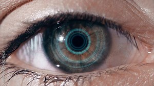Technological lens on the eye. The concept of future technologies. Female eye with futuristic lens, macro